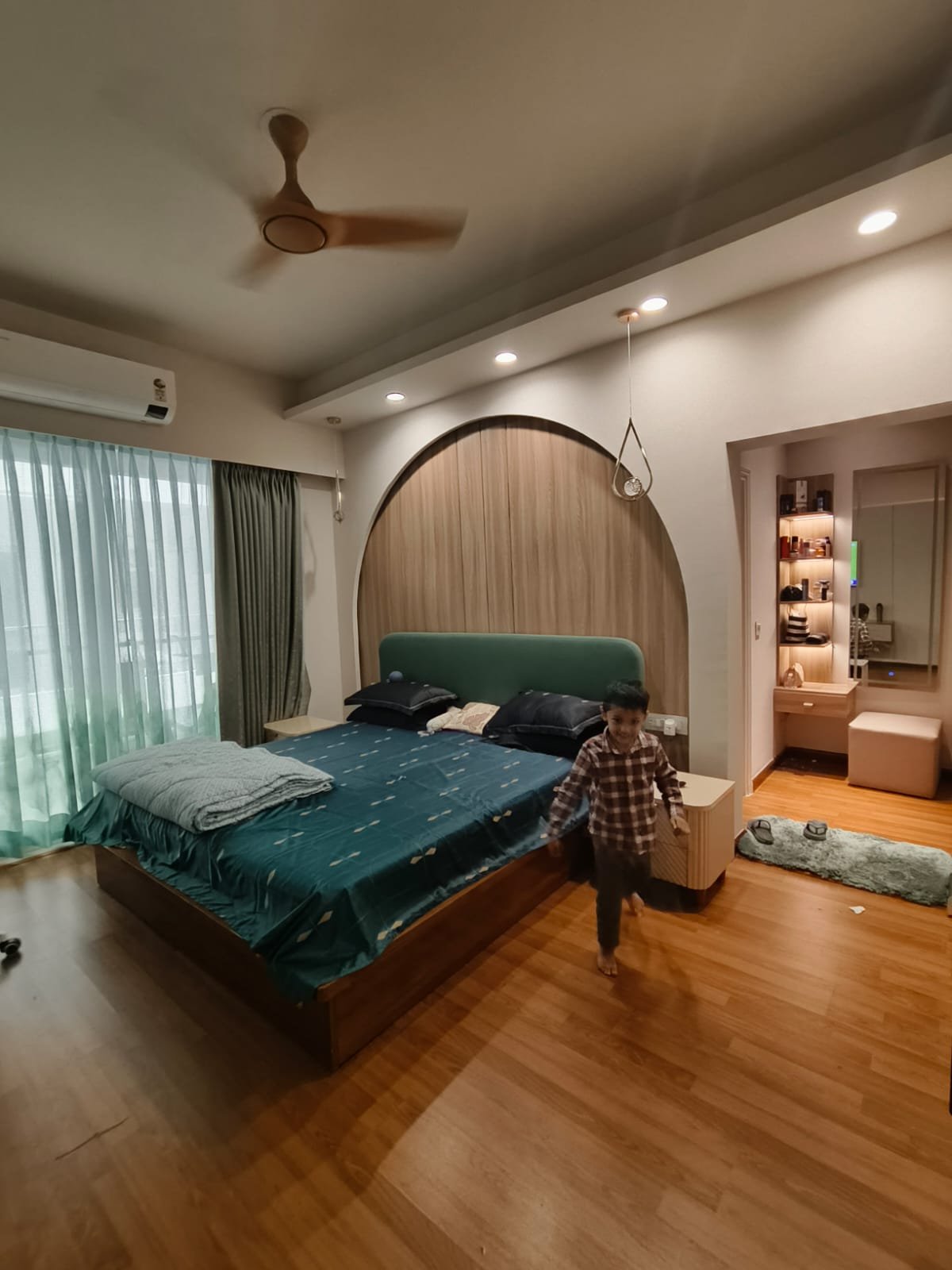 Master bedroom with wooden flooring