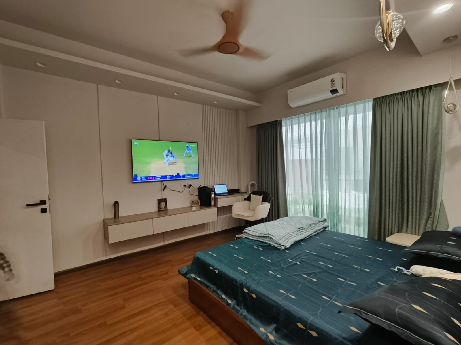 Bedroom TV wall with study ledge
