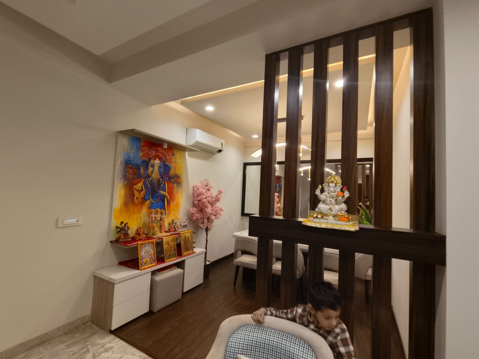Pooja unit behind slatted partition