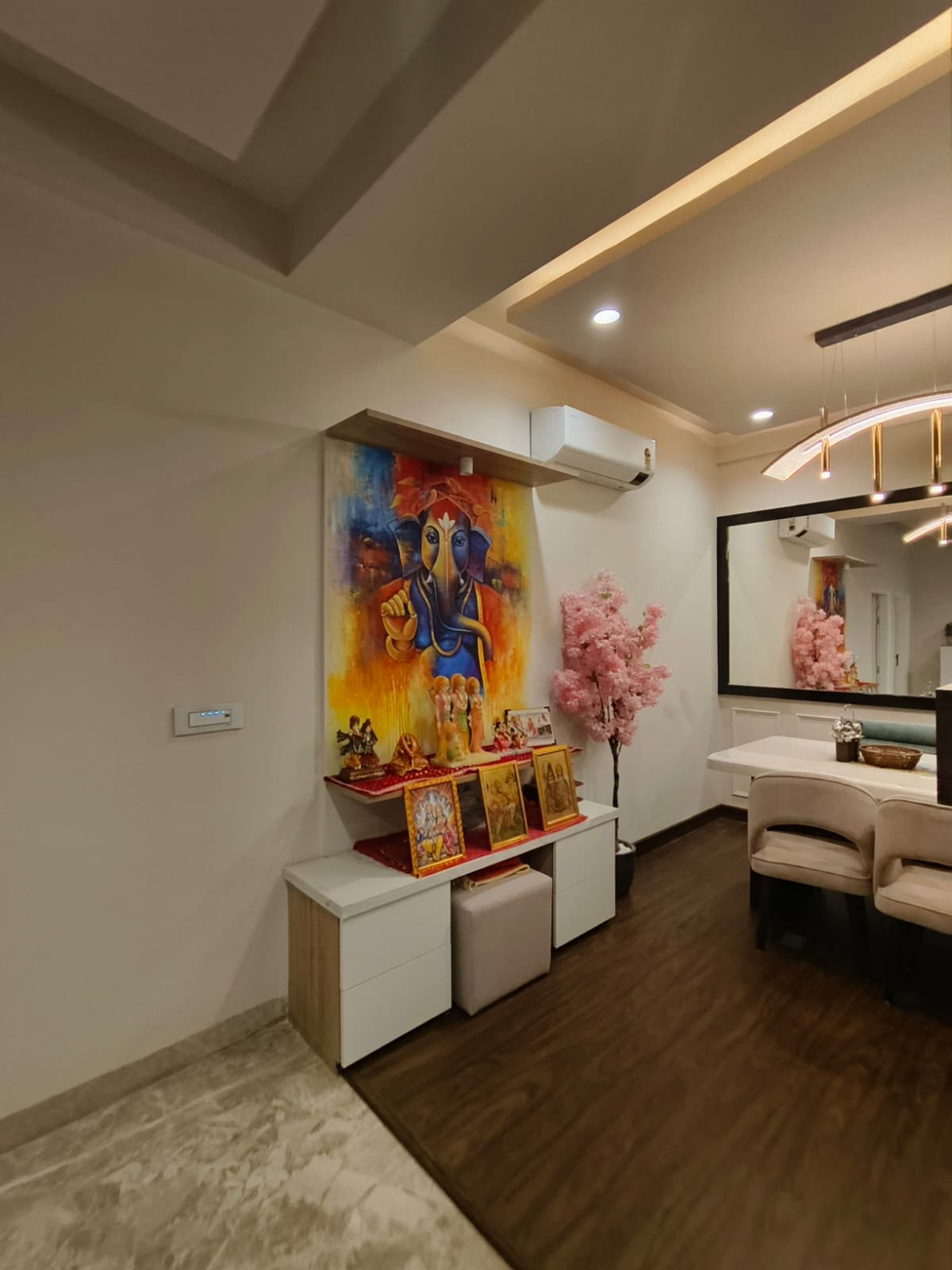 Pooja corner with hand-painted Ganesha art