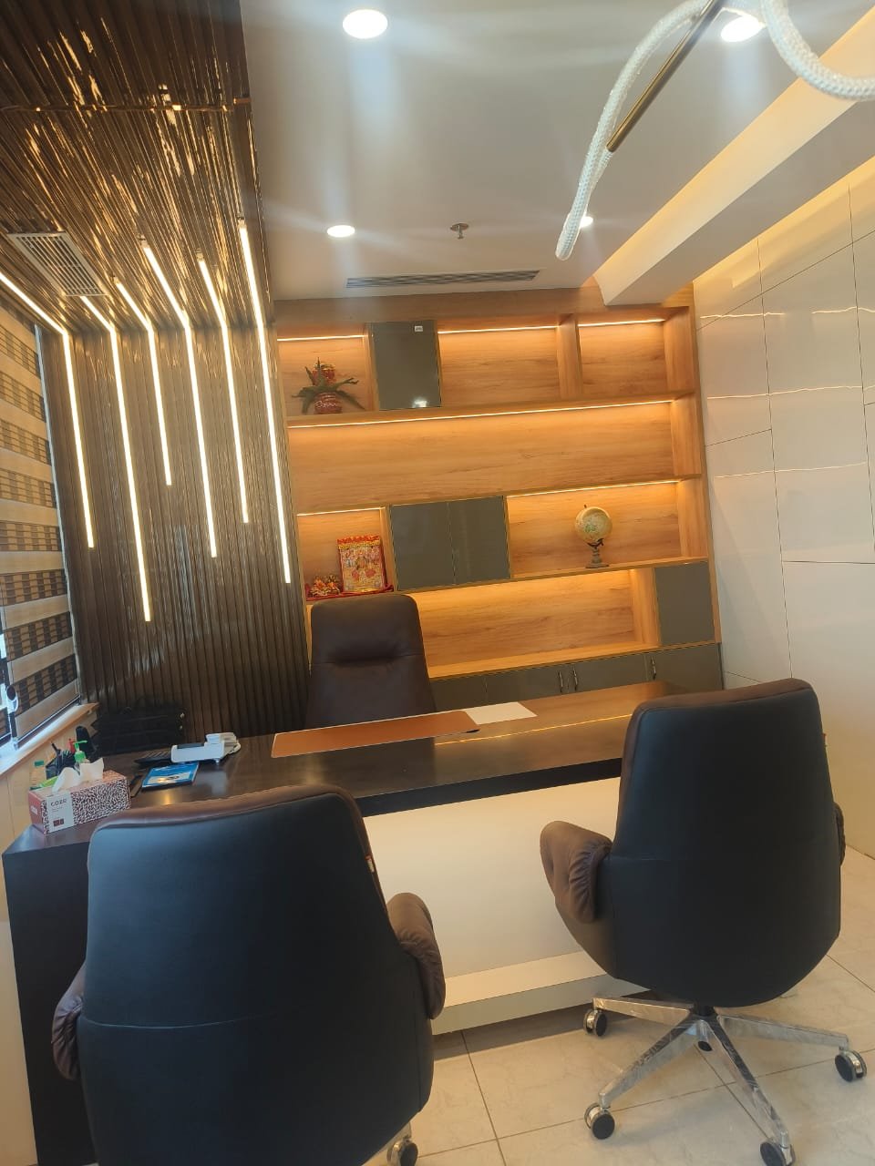 MD cabin with backlit display shelving